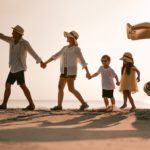 Asian family on the beach.Vacation time. Happy father, mother and son enjoying road trip