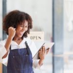 Beautiful American African Businesswoman start small business. A woman works from home delivering