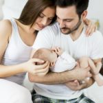 Happy family with newborn baby