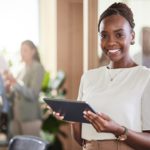 Im the owner of the most successful brand. Shot of a young businesswoman using her digital tablet.