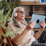 Senior woman spending her leisure time with a digital tablet.