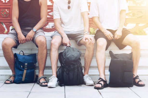 The value of experience. Male tourists exploring the city